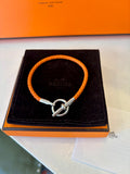 Pre Loved Hermes Glenen H Bracelet in orange braided calfskin with silver hardware