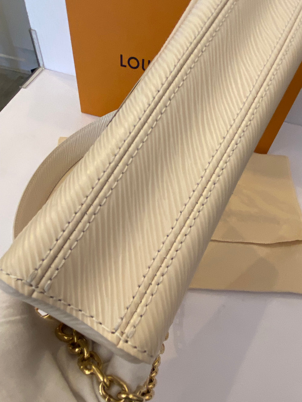 Pre Loved Louis Vuitton Twist West Bag in Quartz - NEW