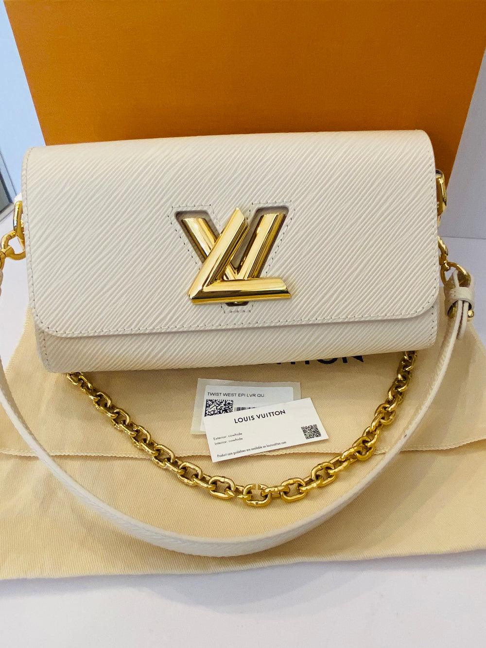 Pre Loved Louis Vuitton Twist West Bag in Quartz - NEW