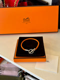 Pre Loved Hermes Glenen H Bracelet in orange braided calfskin with silver hardware