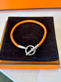 Pre Loved Hermes Glenen H Bracelet in orange braided calfskin with silver hardware