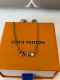 Pre Loved Louis Vuitton Petit Louis Necklace in gold tone featuring LV circle & flower charms
