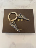 Pre Loved Gucci gold tone key ring/bag charm (new)
