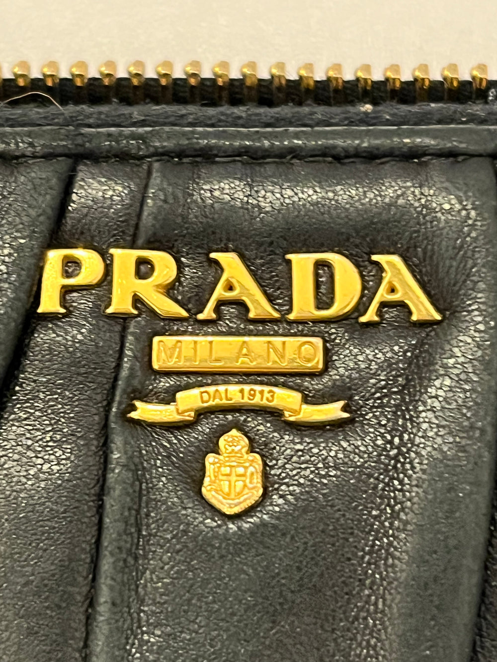 Pre Loved Prada Zip Around Matelasse Leather Purse in Black